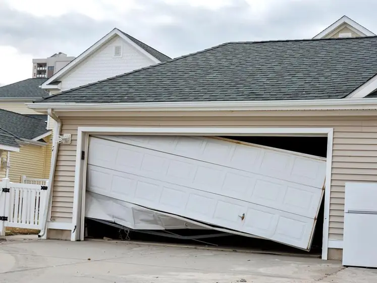 Off-track residential garage door needing repair
